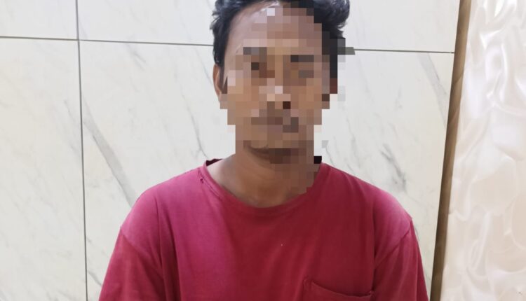 Tersangka AN (34) saat diamankan di Polrestabes Palembang.