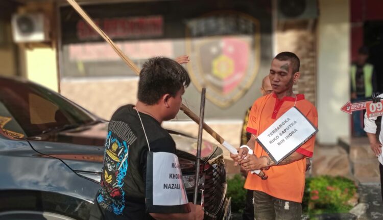Rekontruksi pembunuhan di Simpang Macan Lindungan.